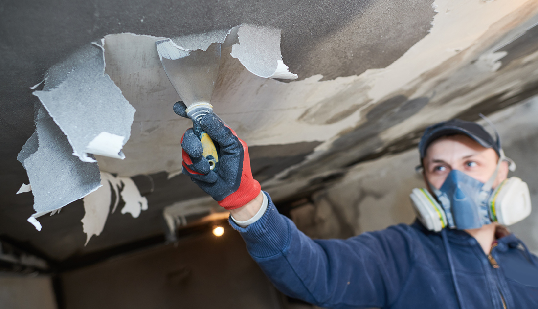 Man Scraping Paper